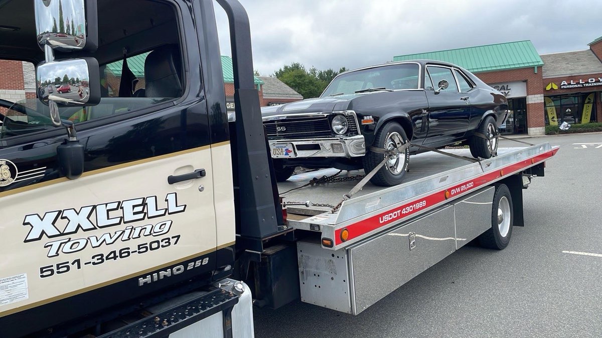 Vintage vehicle transported by XXCELL Towing on a flatbed