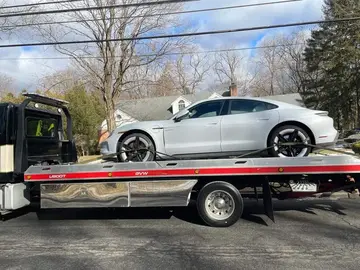 Luxury sedan winter flatbed transport by XXCELL Towing in Bergen County NJ