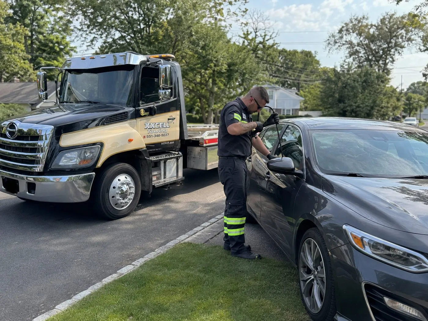 XXCELL Towing technician performing a car lockout in Bergen County NJ