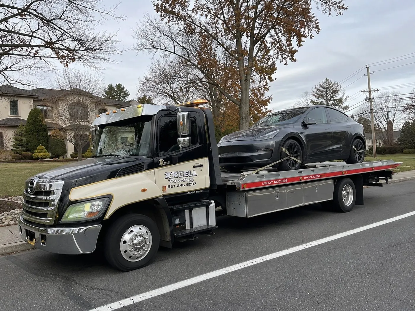 XXCELL Towing flatbed with a Tesla Model Y in Bergen County NJ