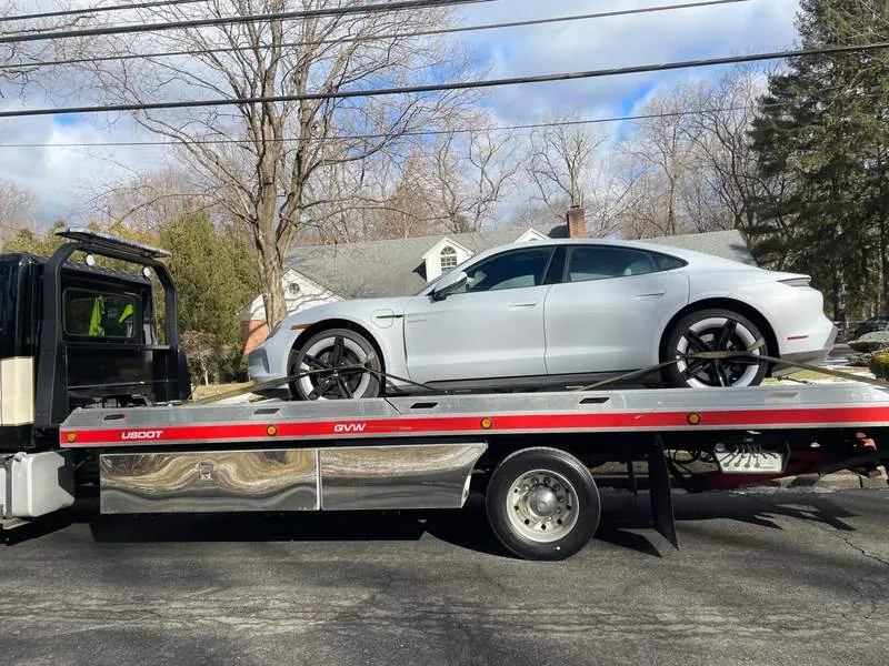 Porsche Taycan winter flatbed tow Bergen County NJ