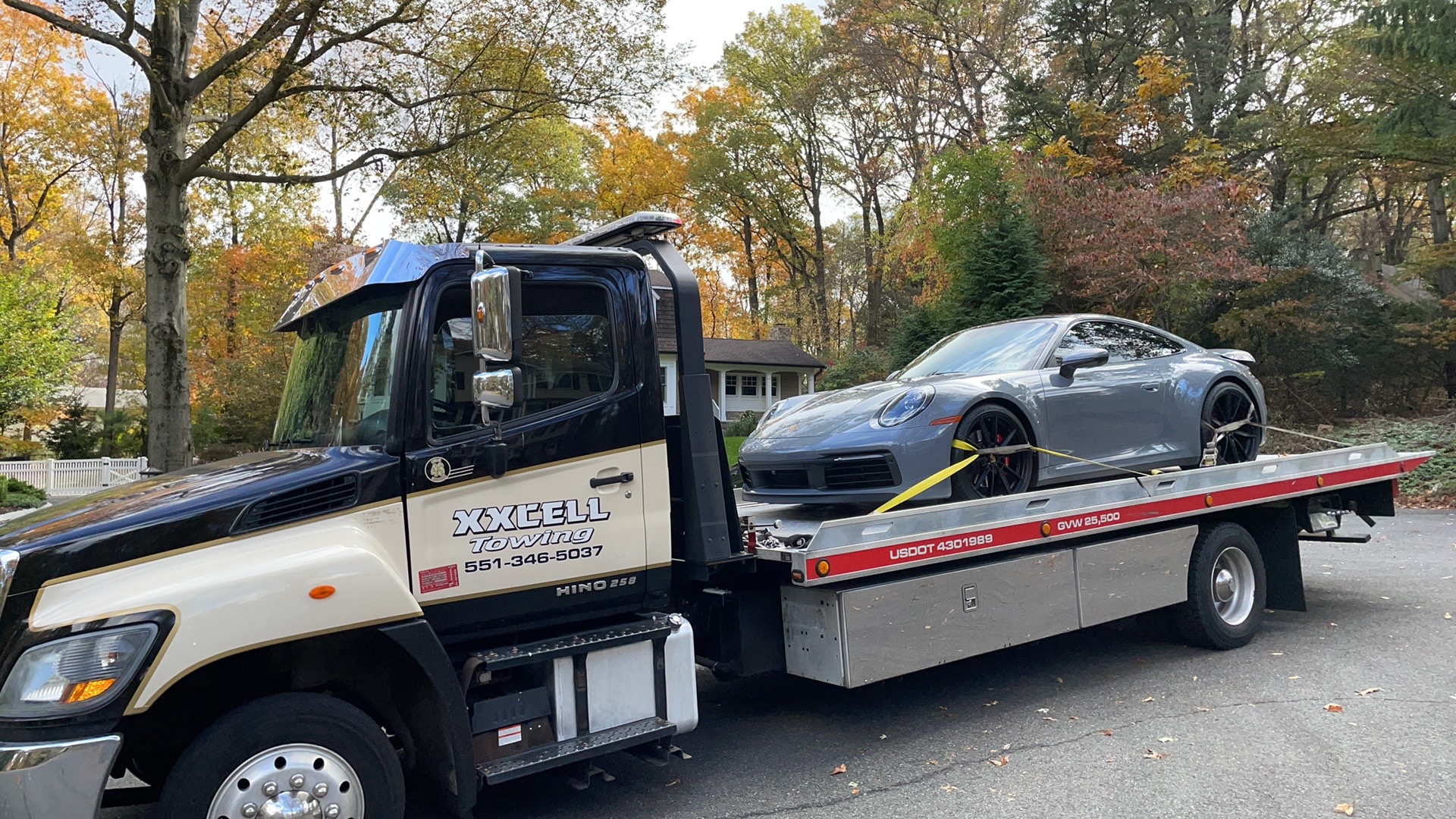 XXCELL Towing professional flatbed service transporting luxury sports car in Bergen County NJ