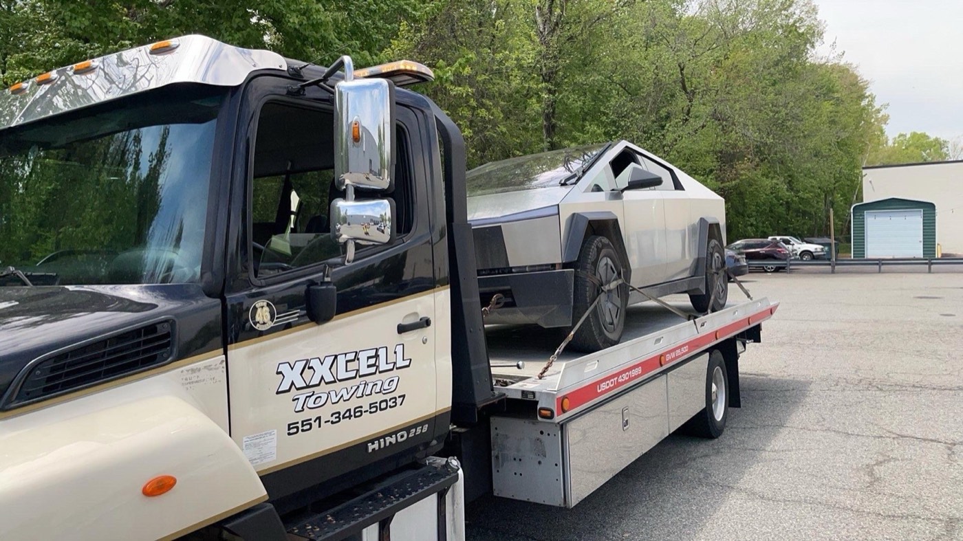 Tesla Cybertruck transported by XXCELL Towing on a flatbed