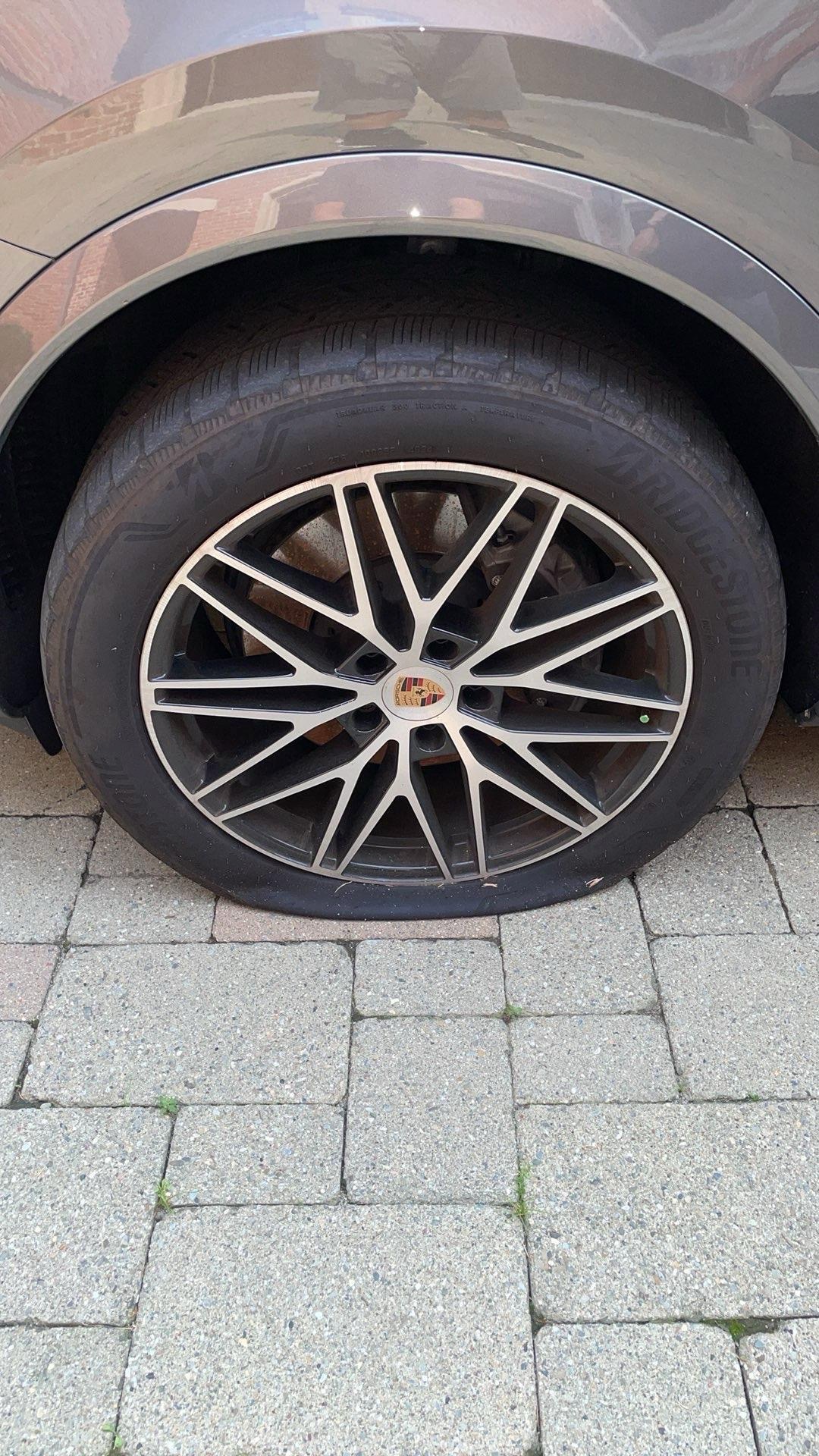 Porsche flat tire roadside assistance job by XXCELL Towing